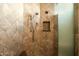 Tiled walk-in shower with dual showerheads, stone bench, and built-in niche at 10040 E Happy Valley Rd # 2022, Scottsdale, AZ 85255