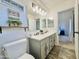 Bright bathroom with a double vanity, framed mirrors, and modern fixtures at 1005 W 19Th Ave, Apache Junction, AZ 85120