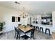 Charming dining area with decorative chandelier, next to the modern kitchen, perfect for entertaining at 1005 W 19Th Ave, Apache Junction, AZ 85120