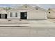 Inviting single-story home with desert landscaping, two-car garage, and a tidy, well-maintained front yard at 1005 W 19Th Ave, Apache Junction, AZ 85120