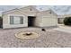 Charming single-story home with a low maintenance desert landscape and attached two-car garage at 1005 W 19Th Ave, Apache Junction, AZ 85120