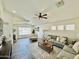 Spacious living room featuring vaulted ceilings, hardwood floors, neutral tones, and lots of natural light at 1005 W 19Th Ave, Apache Junction, AZ 85120