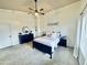 Spacious main bedroom featuring a ceiling fan, carpet, and a calming color palette at 1005 W 19Th Ave, Apache Junction, AZ 85120