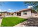 Charming backyard showcasing a well-manicured lawn, gazebo and exterior of home at 1123 E Buckingham Ave, Gilbert, AZ 85297