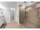 Bathroom featuring glass shower, vanity, and walk-in closet at 1123 E Buckingham Ave, Gilbert, AZ 85297
