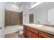 Bathroom featuring vanity and tiled shower at 1123 E Buckingham Ave, Gilbert, AZ 85297