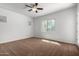 Bright bedroom with carpet flooring and a ceiling fan at 1123 E Buckingham Ave, Gilbert, AZ 85297