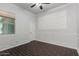 Bedroom featuring wood-look floors, and paneled walls at 1123 E Buckingham Ave, Gilbert, AZ 85297