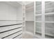 Walk-in closet featuring custom shelving and cabinetry at 1123 E Buckingham Ave, Gilbert, AZ 85297
