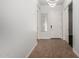 Bright home entry featuring tile floors, modern lighting, and a white front door at 1123 E Buckingham Ave, Gilbert, AZ 85297