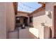 Covered entry with string lights, decorative lanterns, and a neutral color scheme at 1123 E Buckingham Ave, Gilbert, AZ 85297