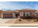 Charming single-story home featuring a well-maintained front yard and a two-car garage at 1123 E Buckingham Ave, Gilbert, AZ 85297