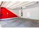 Spacious garage featuring painted accent wall and electric vehicle charging outlet at 1123 E Buckingham Ave, Gilbert, AZ 85297
