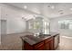 Modern kitchen featuring a large island, stainless steel appliances, and tile backsplash at 1123 E Buckingham Ave, Gilbert, AZ 85297