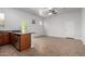 Open floor plan showcasing the kitchen with stainless steel appliances and ample counter space at 1123 E Buckingham Ave, Gilbert, AZ 85297