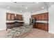 Well-equipped kitchen with a center island, stainless steel appliances, and custom cabinetry at 1123 E Buckingham Ave, Gilbert, AZ 85297