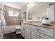 This bathroom features a vanity with drawers, a mirror, and a shower at 1237 E Gemini Dr, Tempe, AZ 85283