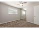 This bedroom features carpet flooring, a window, and mirrored closet doors at 1237 E Gemini Dr, Tempe, AZ 85283