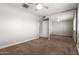 This bedroom features carpet flooring, ceiling fan, and mirrored closet doors at 1237 E Gemini Dr, Tempe, AZ 85283