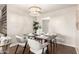 Bright dining area features a modern chandelier and seating for four at 1237 E Gemini Dr, Tempe, AZ 85283