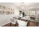 Dining area showcasing the lighting fixture, seating, and connecting living spaces at 1237 E Gemini Dr, Tempe, AZ 85283