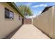 Wide driveway and exterior wall, leading to the backyard area at 1237 E Gemini Dr, Tempe, AZ 85283