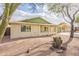 A cozy single-story home featuring desert landscaping with decorative green accents on the roof and garage at 1237 E Gemini Dr, Tempe, AZ 85283
