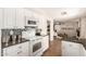 Kitchen showcases modern appliances, a mosaic backsplash, and a view into the living area at 1237 E Gemini Dr, Tempe, AZ 85283