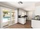 Bright kitchen showcasing sliding doors to the pool area and ample counter space at 1237 E Gemini Dr, Tempe, AZ 85283