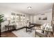 Bright living room with wood floors and neutral accents near front entrance at 1237 E Gemini Dr, Tempe, AZ 85283