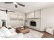 Living room showcasing a white brick fireplace, decor, and a ceiling fan at 1237 E Gemini Dr, Tempe, AZ 85283