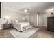 Neutral main bedroom with a ceiling fan, a bench, and elegant decor at 1237 E Gemini Dr, Tempe, AZ 85283