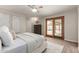 Bright main bedroom with ceiling fan and sliding door access to outdoor pool area at 1237 E Gemini Dr, Tempe, AZ 85283