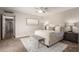 Relaxing main bedroom with light walls, ceiling fan and comfortable furniture at 1237 E Gemini Dr, Tempe, AZ 85283