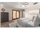 Cozy main bedroom with a ceiling fan, light colored walls, and sliding glass door at 1237 E Gemini Dr, Tempe, AZ 85283