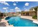 Backyard pool with a diving board, waterfall feature, and a covered patio area at 1237 E Gemini Dr, Tempe, AZ 85283