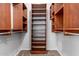 Walk-in closet with custom wood shelving for organized storage at 1237 E Gemini Dr, Tempe, AZ 85283