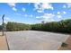 Basketball court area with high privacy hedges and a basketball hoop at 12620 N 70Th St, Scottsdale, AZ 85254