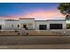 Modern home exterior showcasing the desert landscaping and two-car garage under a beautiful sunset sky at 12620 N 70Th St, Scottsdale, AZ 85254