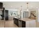 Modern kitchen with stainless steel appliances, a large island and an open view to other living areas at 12620 N 70Th St, Scottsdale, AZ 85254