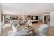 Spacious living room with modern furnishings and an open floor plan leading to the kitchen and dining area at 12620 N 70Th St, Scottsdale, AZ 85254