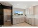 Pantry with lots of adjustable storage in neutral tones with a view from the kitchen at 12620 N 70Th St, Scottsdale, AZ 85254