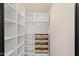 A well-organized pantry with multiple shelving units and drawers for optimal storage solutions at 12620 N 70Th St, Scottsdale, AZ 85254