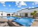 Backyard pool and jacuzzi surrounded by lush landscaping offers a private and luxurious outdoor retreat at 12620 N 70Th St, Scottsdale, AZ 85254