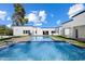 Backyard pool and jacuzzi surrounded by lush landscaping offers a private and luxurious outdoor retreat at 12620 N 70Th St, Scottsdale, AZ 85254