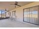 Covered back porch with ceiling fans overlooking the backyard at 1459 S Mara Dr, Apache Junction, AZ 85120