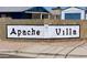 Street view of community sign with the name Apache Villa with a sign 55+ Active Adult Community at 1459 S Mara Dr, Apache Junction, AZ 85120