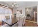 Well-lit dining room offering a wood table with seating for six and chandelier at 1459 S Mara Dr, Apache Junction, AZ 85120