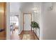 Inviting entryway showcasing wood floors, neutral walls, and a decorative plant at 1459 S Mara Dr, Apache Junction, AZ 85120
