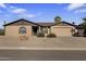 Charming home with a two-car garage, desert landscaping, and a welcoming entrance at 1459 S Mara Dr, Apache Junction, AZ 85120